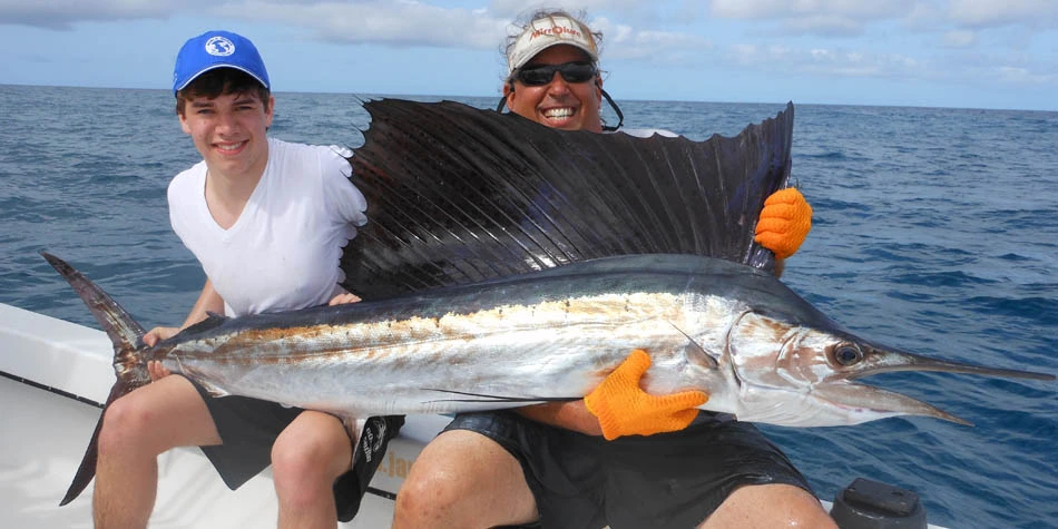 Two men on deep sea fishing charter off the coast of St. Petersburg, FL.