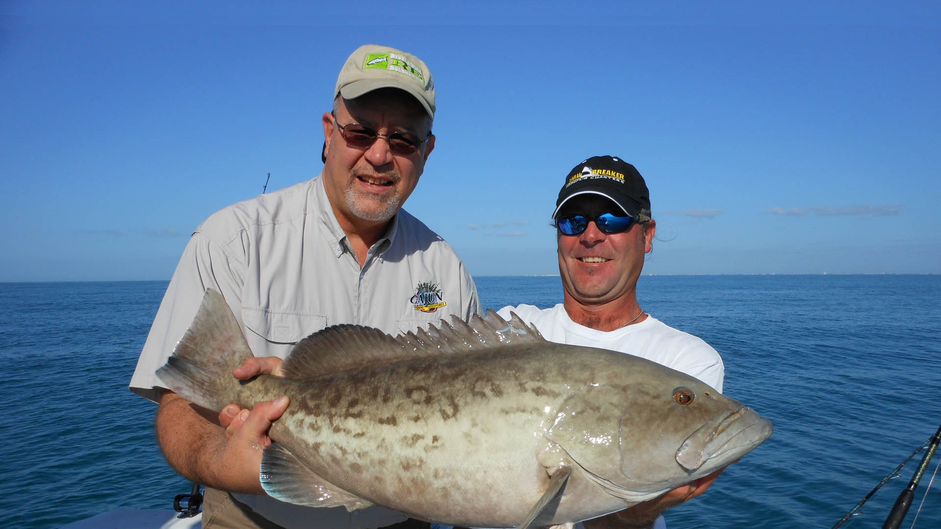 Capt. Dan Barry w/ customer on Grouper fishing charter in St. Petersburg, FL.