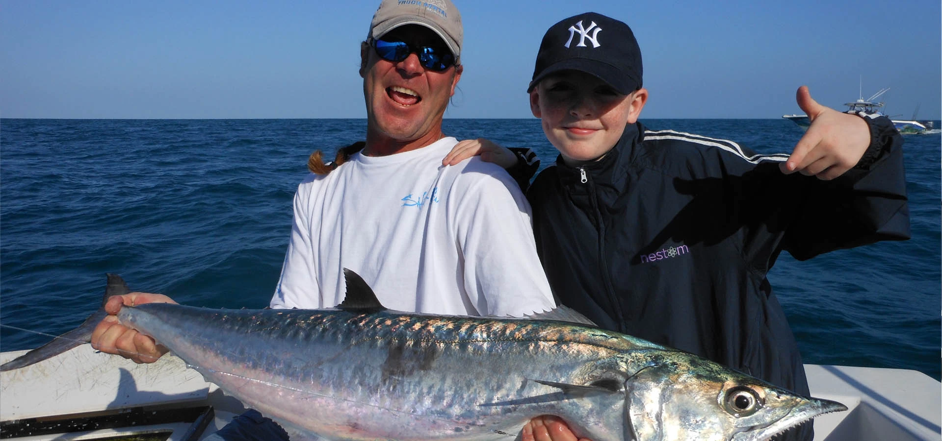 Capt. Dan Barry and young boy with Kingfish.