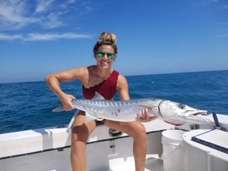 Young kid caught Kingfish during St. Petersburg, FL fishing charter.